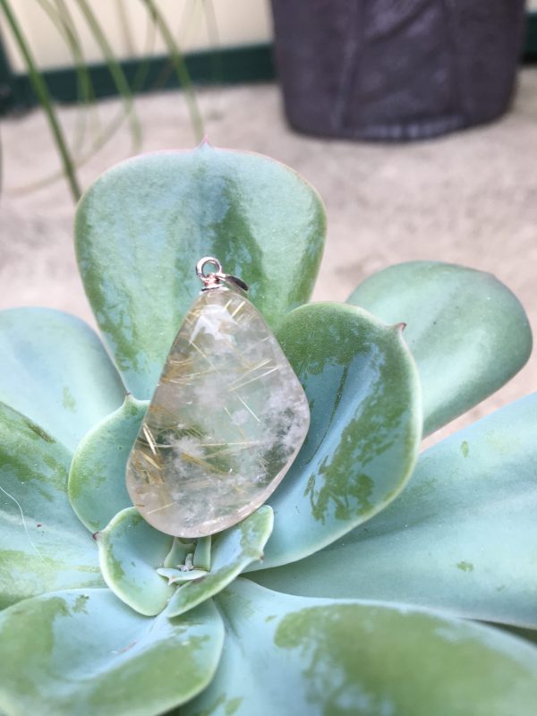 JEWELLERY, PENDANTS rutilated quartz polished 25mm